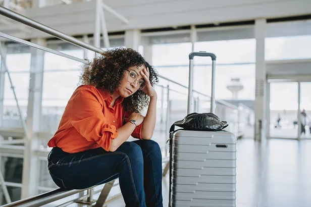 airport suitcase missing woman waiting
